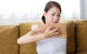 Woman who needs a water softener because of itchy skin